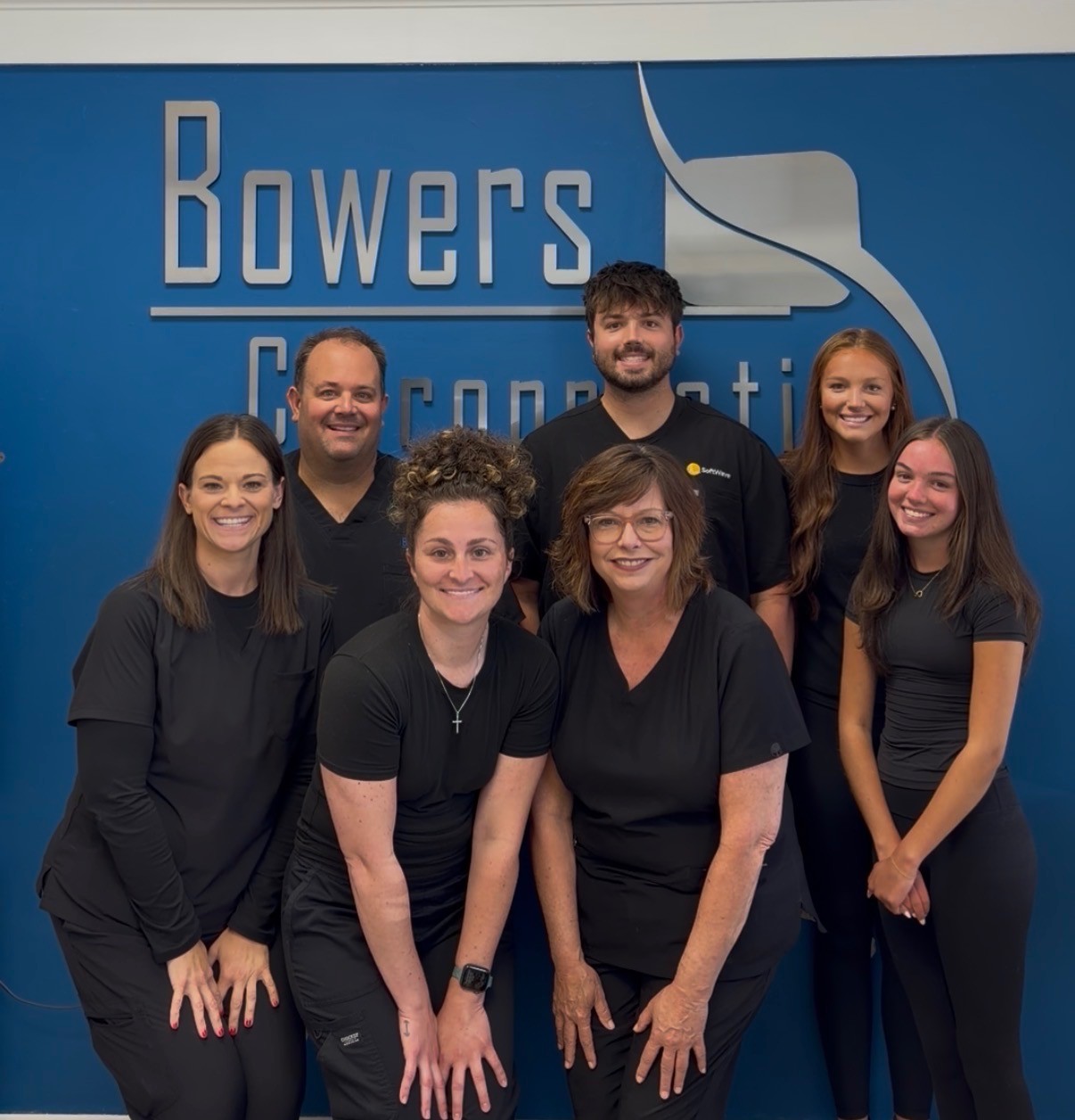 Dr. Kyle Bowers and the Bowers Chiropractic team standing in their Columbia, MO office
